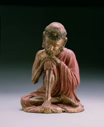 Red lacquer figure of Sakyamuni, the founder of the Buddhist faith, emerging from the mountains, Yan Dynasty