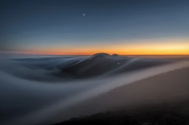 Twilight Mountains Above Clouds