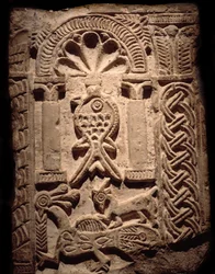 Coptic civilization: wall fragment of high reliefs with fish (Christian symbol). 6th or 7th century AD. Luxor, Egyptian Art Museum