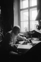 Jiri Mucha Sitting at His Desk in His House in Hradcany, Prague