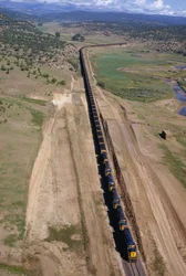 Mile-long unit train of Atchison, Topeka, Santa Fe line rumbles. Northern New Mexico.