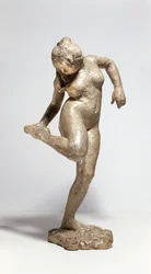 Dancer Looking at the Sole of Her Foot