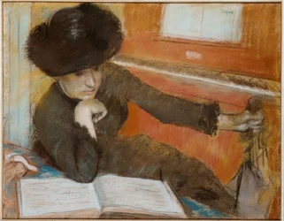 Woman Sitting in Front of a Piano