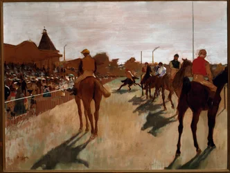 The parade or race horses in front of the stands