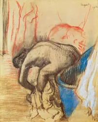Woman drying her left leg