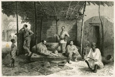 Establishment of the mission in Nango for a 10-month stay, with portraits of Gallieni and his captains Vallière and Pietri, Doctor Tautain, as well as his interpreters, guide and canteen keeper. Engraving by Riou, based on a sketch by the author, to