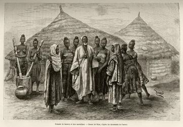 Women of Samory Toure war chief of the Niger loop and their supervisor, Sonninke, who knows how to read and write Arabic, as evidenced by the paper he holds in his hand. Engraving to illustrate the story From Niger to the Gulf of Guinee by Captain Louis Gu