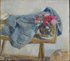 Red Roses and Fabrics on a Table