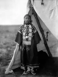 Rosa Lame Dog, Dakota Woman Standing at Doorway of Tipi, c. 1905