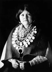Young Indian woman wearing Zuni ornaments