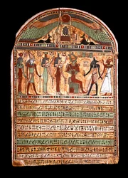 Egyptian antiquities: funerary stele of a high priest: Osiris welcomes the deceased present in Anubis, behind him the deities Isis, Nephtis (Nephtys or Neftis), Horus, Hathor. 3rd-2nd century BC. Turin, Egyptian museum