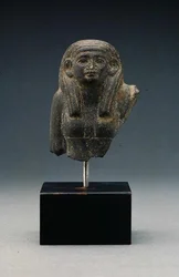 Head and shoulders of a woman from a group statue, probably a funerary dyad, Middle Kingdom