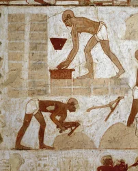 Craftsmen Laying Bricks and Building Pylons