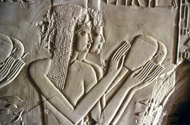 Egyptian antiquity: young girls making offerings. Tomb of Kherouef