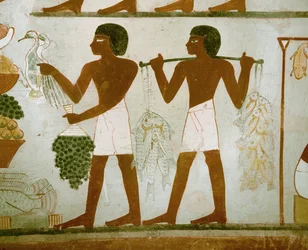 Men carrying fruit and food for the deceased