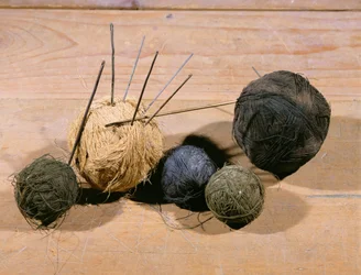 Wool balls with knitting needles