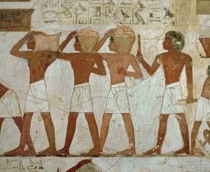 Workmen carrying gold ingots