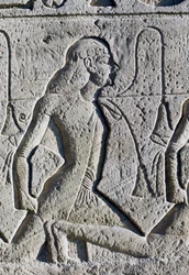 Relief depicting Black and Asian prisoners from the Battle of Kadesh, detail from base of thrones on facade of Great Temple of Ramses II, Abu Simbel (UNESCO World Heritage List)