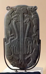 Palette Depicting Four Dogs and Two Giraffes with a Palm Tree