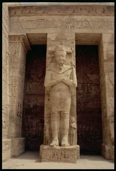 One of the standing figures of Ramesses III as the god Osiris, east side of the first court of the Mortuary Temple of Ramesses III