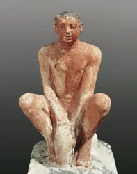 Egyptian civilization, painted limestone statue depicting a man modeling clay, from Saqqara, Egypt, ca. 2465, 5th century BC