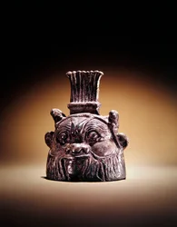 Bell in the form of Bes