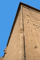 Egyptian antiquity: corner of the back wall of the temple dedicated to the goddess Hathor (on the right representation of Cleopatra). Denderah, Egypt