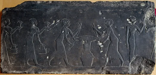 Limestone plate decorated with low relief representing the pressing of lotus flowers, 8th to 7th century BC (relief)
