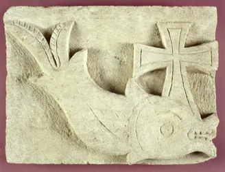 Relief of a dolphin carrying a cross