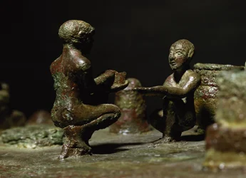 Crouching figures from a small group statue depicting Sit Shimsi, the rite to the rising sun, Elamite Period, from Susa, southwestern Iran