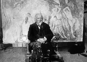 Paul Cézanne (1839-1906), French painter in 1904 in front of one of his canvases showing bathers