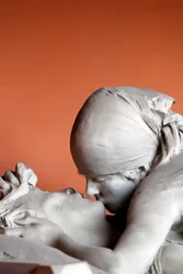 Monumental Cemetery. The Kiss on a tombstone. Milan. Italy.