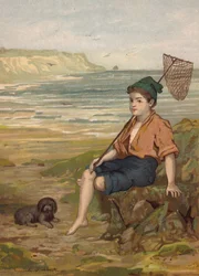 Boy with a fishing net at the seaside