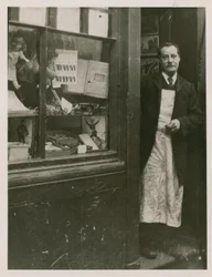 A Shopkeeper Standing in the Doorway of His Shop