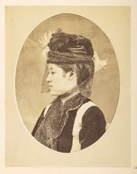 Japanese woman in European dress, Oval image; head-and-shoulders left profile portrait