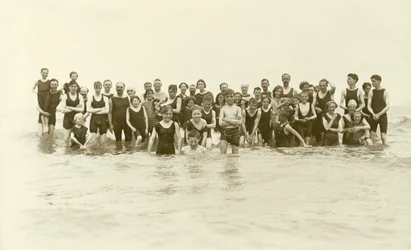 Large group of swimmers standing in the water