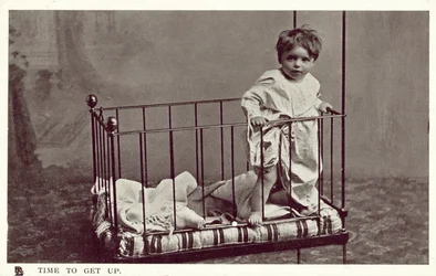 Little boy in a crib