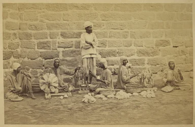 Male prisoners winding cotton on spinning wheels in Karachi Prison