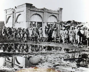 Prisoners passing the Mihrab, the Khalifa