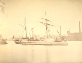 The starboard side of the gunboat Delta moored in the River Tyne, c.1876