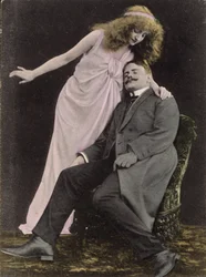 Woman Looking Over a Sleeping Man