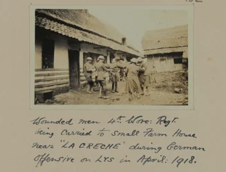 Wounded men, 4th, Worc: Regt. being carried to small farm house near 
