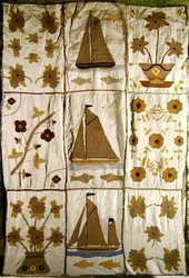 A Quilted Bed Spread of Sailing Ships and Flowers
