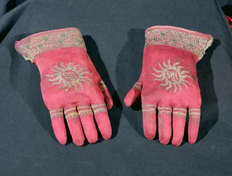 A pair of knitted silk gloves, possibly once belonging to Archbishop William Warham, late 15th or early 16th century