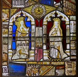 A panel in the east window depicting the Cardinal Virtues: Mercy (Misericordia) and Peace (Pax) and a white rose