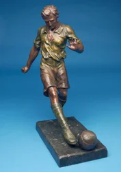 Figure kicking a ball