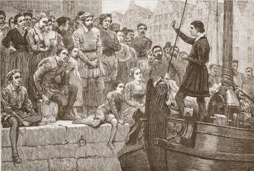 Nicholas preaching to the crowd from a boat on the Scheldt