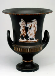 Wedgwood vase depicting a young girl and a black ceramic satyr painted 