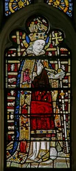 Window depicting St Thomas Becket with jewels of inset glass
