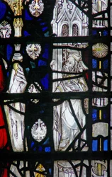 Window depicting a border panel with a figure